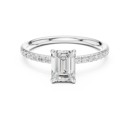 Diamond ring with emerald-cut center stone on a white background